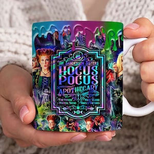 May include: A white ceramic mug with a colorful design featuring the Sanderson Sisters from the movie Hocus Pocus. The design includes a dripping effect with green, purple, and blue colors. The text on the mug reads "The Sanderson Sisters Hocus Pocus Apothecary Fine Potions Magic Elixirs Mystical Brews Tonics & Tinctures".