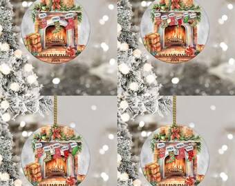 May include: A round Christmas ornament with a painted image of a fireplace with stockings hanging from the mantle. The stockings are personalized with names and the fireplace has a roaring fire. The ornament is decorated with a red bow and the text "WILLAMS FAMILY 2024".