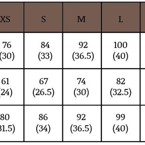 May include: A size chart for clothing, with measurements in centimeters and inches. The chart includes bust, waist, and hip measurements for sizes XS to 3XL. The bust measurements range from 30 inches to 53 inches.
