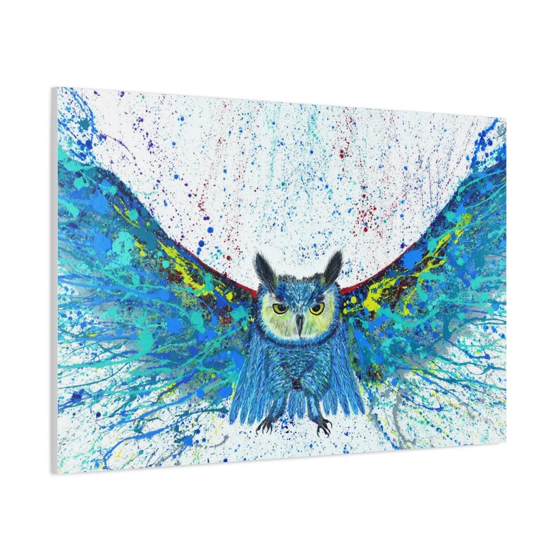 May include: A blue owl with yellow eyes is painted in a splatter style with blue, green, yellow, and red paint on a white background.