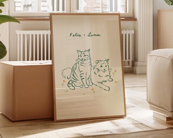 May include: A vertical rectangular framed print featuring a line art illustration of two cats sitting side by side. The text "Felix + Luna" is written in a dark green script above the cats, accompanied by small orange flower accents.