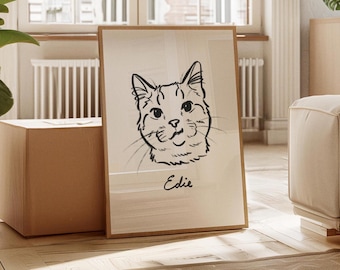 Könnte beinhalten: Ein gerahmter Druck mit einer Schwarz-Weiß-Skizze eines Katzenkopfes. Der Name "Edie" ist in Kursivschrift unter dem Bild geschrieben. Das Kunstwerk wird in einem hellen Holzrahmen präsentiert.