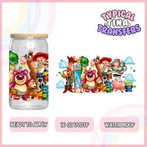 May include: A 16 ounce clear plastic tumbler with a bamboo lid and straw. The tumbler features a colorful graphic of characters from the Toy Story movie franchise. The graphic includes Woody, Buzz Lightyear, Jessie, Bullseye, Rex, Slinky Dog, and other characters. The text "Typical Tina Transfers" is in the upper right corner of the image. The text "Ready to Apply", "16 oz UVDTF", and "Waterproof" are at the bottom of the image.