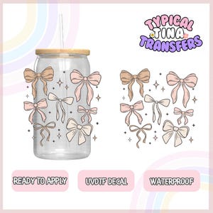 May include: A set of 10 pink and brown bow decals for a tumbler or other smooth surface. The decals are ready to apply, waterproof, and UV-resistant. The decals are shown on a clear glass tumbler with a wooden lid and a straw.
