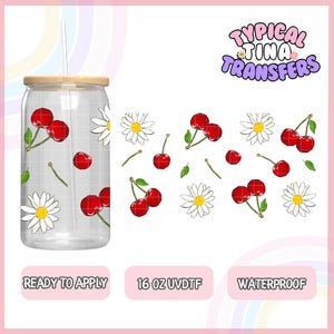 May include: A 16 ounce clear glass tumbler with a wooden lid and a straw. The tumbler has a pattern of red cherries and white daisies. The tumbler is ready to apply with a waterproof UV-DTG transfer.