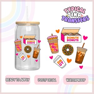 May include: A clear tumbler with a wooden lid and a straw. The tumbler is decorated with donut-themed stickers, including a donut box, donuts, coffee cups, and hearts. The text "Donuts' Donuts" is visible on the stickers. The text "Typical Tina Transfers" is visible at the top of the image. The text "Ready to Apply", "UVDTF Decal", and "Waterproof" is visible at the bottom of the image.