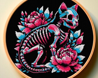 May include: A cross-stitch embroidery hoop with a black background featuring a pink and blue skeletal cat surrounded by pink and blue flowers.