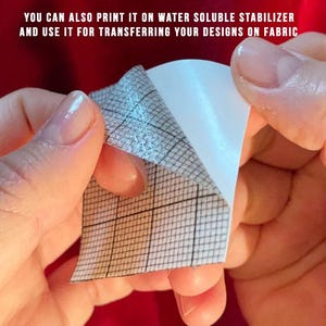 May include: A close-up of a piece of paper being peeled back, revealing a grid pattern. The text at the top says, "YOU CAN ALSO PRINT IT ON WATER SOLUBLE STABILIZER AND USE IT FOR TRANSFERRING YOUR DESIGNS ON FABRIC."