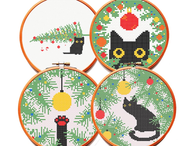 May include: Four circular wooden embroidery hoops containing cross-stitch patterns of black cats in holiday settings. Designs include a cat with a Christmas tree, a cat in a wreath, a cat paw reaching for an ornament, and a cat sitting under branches.