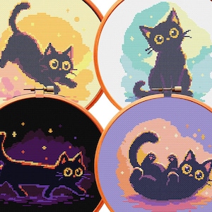 May include: Four circular wooden embroidery hoops containing cross-stitch patterns of black cats. Each hoop features a different cat pose against a pixelated background in yellow, light blue, dark purple, and lavender with small star accents.