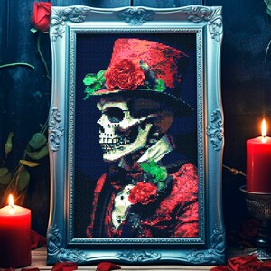 May include: A framed painting of a skull wearing a red top hat with red roses. The skull is wearing a bow tie and a red jacket. The painting is set against a dark blue background.