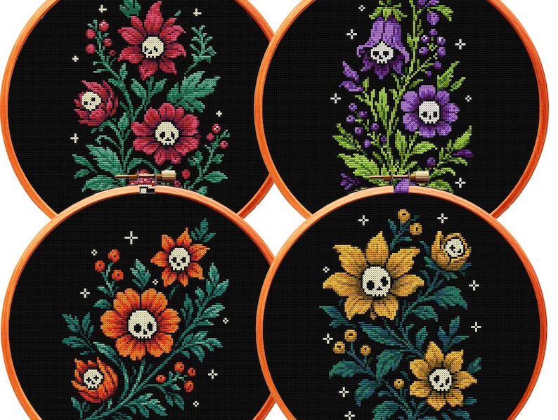 May include: Four circular wooden embroidery hoops containing black fabric with cross-stitched floral designs. Each flower features a small white skull at its center, surrounded by green leaves, berries, and small white cross-shaped stars.