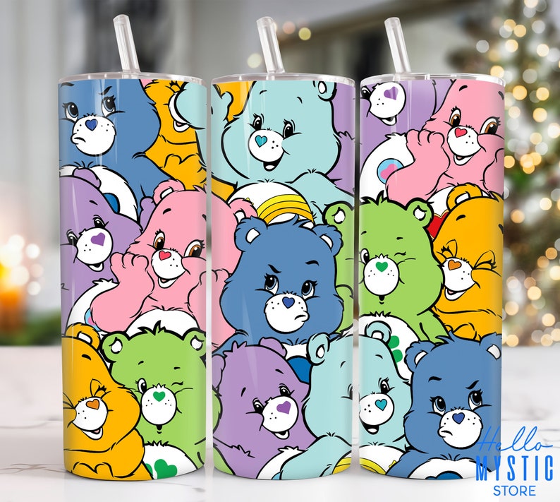 May include: Three stainless steel tumblers with a white background and a pattern of colorful Care Bears. The Care Bears are in various poses and have different facial expressions. The tumblers are all the same size and have a straw in them. The text 'Hello Mystic Store' is visible on the bottom right tumbler.