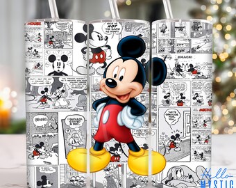 May include: A white tumbler with a black and white comic strip design featuring Mickey Mouse. The tumbler has a straw and a black and white image of Mickey Mouse on the front.