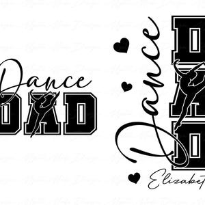May include: Black and white graphic design featuring the words "Dance Dad" in a bold, collegiate-style font. A silhouette of a dancer is incorporated into the design. Additional design includes hearts and the name "Elizabeth".