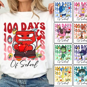 May include: White t-shirt with a red, angry character from the movie Inside Out holding an apple. The shirt has the text "100 Days Of School" printed on it. The background is a gradient of pink, red, and orange.