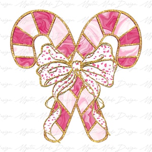 May include: Two pink and white candy canes with gold glitter accents are tied together with a pink and white bow with gold glitter accents.