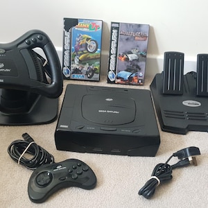 Sega Saturn Bundle steering wheel, foot pedals and 2 games