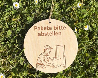 Door sign "Please leave parcels here." Wooden door sign including leather cord.