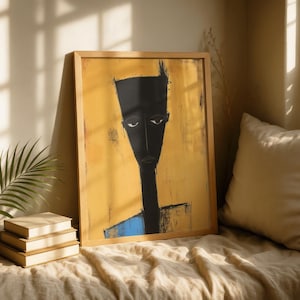 May include: A framed wall art print featuring a stylised, elongated black figure with a flat-topped head and neutral expression set against a textured mustard yellow background with a small blue accent at the bottom edge of the figure's torso.