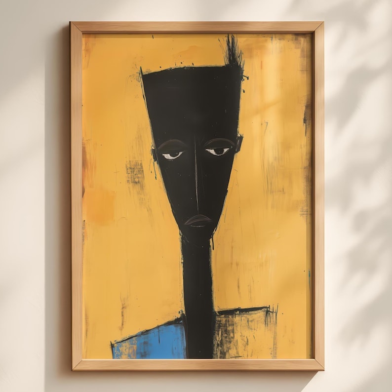 May include: A framed wall art print featuring a stylised, elongated black figure against a textured mustard yellow background. The figure has a tall, flat-topped head, narrow facial features, and a small blue section at the bottom of the torso.