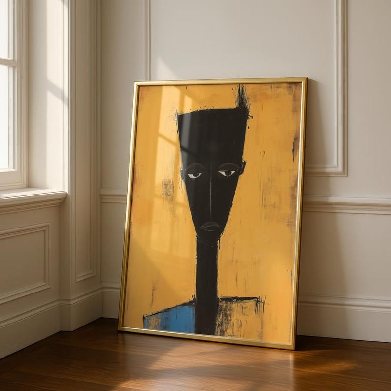 May include: A framed vertical wall art print featuring a stylised, elongated black figure with a flat-topped head and neutral expression set against a textured, mustard-yellow background with a small blue accent at the bottom of the figure's torso.