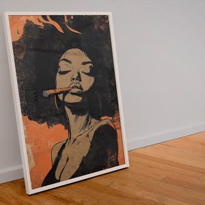 May include: A framed illustration of a woman with dark hair and a cigarette in her mouth. The background is a peach color with a textured look.