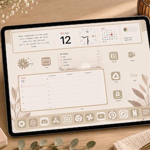 May include: A tablet screen displaying a digital planner interface with a beige and cream color palette. The layout includes a calendar, a clock, a task list, and various app icons. Text on the screen reads: What happened in the past is a lesson that we will take for the future. Don't be stuck for a long time.