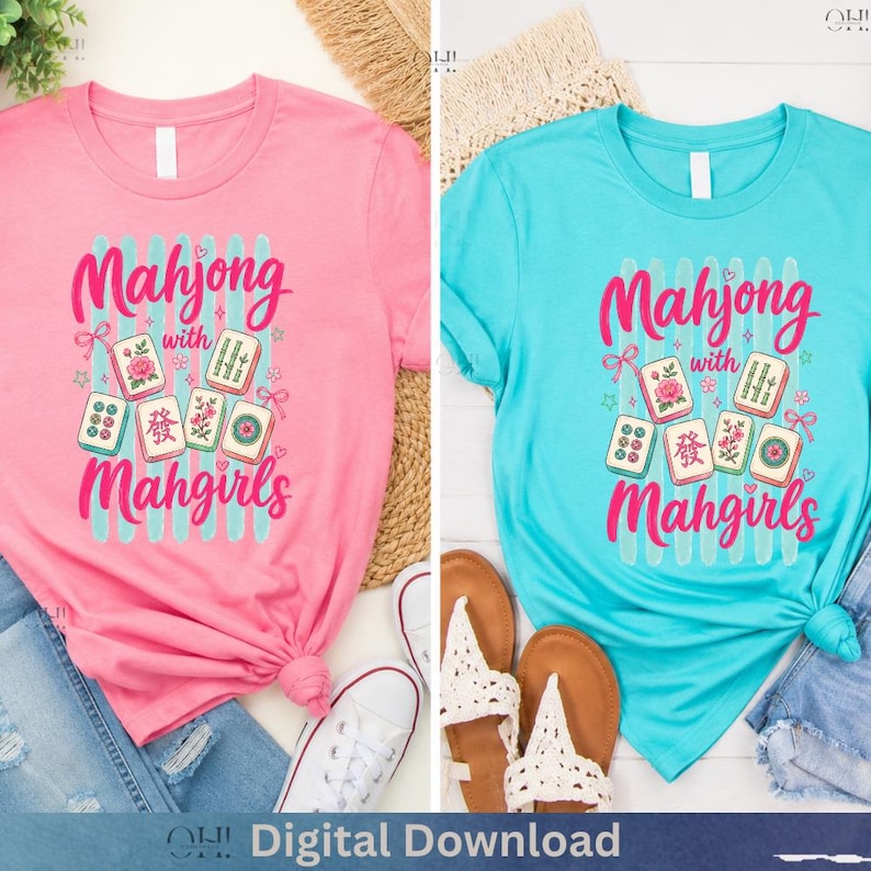 May include: Two t-shirts, one pink and one turquoise, featuring the text "Mahjong with Mahgirls" in a script font. The design includes illustrations of Mahjong tiles and decorative elements. The pink shirt is paired with jeans and white sneakers, while the turquoise shirt is styled with sandals.