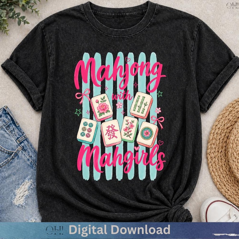 May include: Black t-shirt featuring a graphic design with the text "Mahjong with Mahgirls" in pink. The design includes light blue vertical stripes and illustrations of Mahjong tiles. The words "Digital Download" are at the bottom.