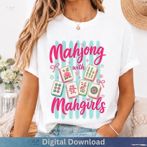 May include: White t-shirt with the text "Mahjong with Mahgirls" in pink script. The design includes illustrations of Mahjong tiles, stars, and bows, set against a backdrop of vertical teal stripes. "Digital Download" is at the bottom.