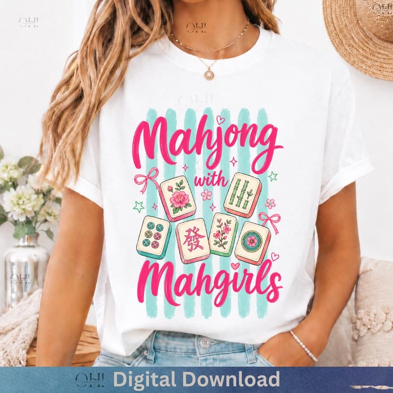 May include: White t-shirt with the text "Mahjong with Mahgirls" in pink script. The design includes illustrations of Mahjong tiles, stars, and bows, set against a backdrop of vertical teal stripes. "Digital Download" is at the bottom.