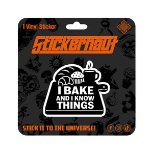 May include: A black and white vinyl sticker with the text "I BAKE AND I KNOW THINGS" and a graphic of baked goods and a coffee cup. The sticker is on a dark gray background with the "Stickernaut" logo in orange.