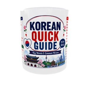 May include: A white ceramic mug featuring the text KOREAN QUICK GUIDE and Key Words & Common Phrases. The design includes a heart with the South Korean flag, pink flowers, and a colorful illustration of a traditional palace and city skyline.
