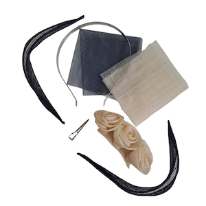 May include: An assortment of millinery supplies, including a navy blue headband, a silver headband, navy and cream-colored mesh fabric, a silver hair clip, and a cream-colored floral embellishment. These items are used for creating hats and headpieces.