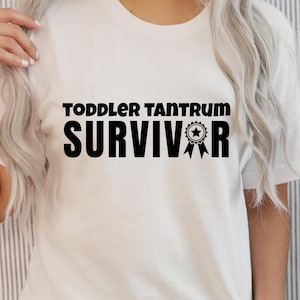 Toddler Tantrum Survivor – Funny Parenting PNG Graphic (White & Black Versions)