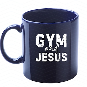 May include: A dark blue ceramic coffee mug with a white design that says "GYM and JESUS".