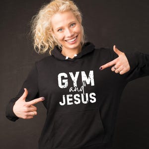 May include: Black hoodie with a white graphic that says "GYM and JESUS".