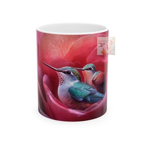 Hummingbird and Rose Ceramic Mug, 11oz - Vibrant Green, White, and Reddish-Orange Birds on Soft Pink Flower - Dreamy and Serene