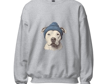 Puede incluir: Una sudadera gris claro con un gráfico de un perro blanco con un gorro azul. La cara del perro está centrada en la parte delantera de la sudadera. La sudadera tiene mangas largas y cuello redondo.