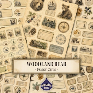 May include: A collection of vintage-style paper stickers featuring illustrations of bears, pinecones, forest cabins, compasses, and specimen labels with the text WOODLAND BEAR - FUSSY CUTS and INDIGOINK PRESS printed on the sheets.