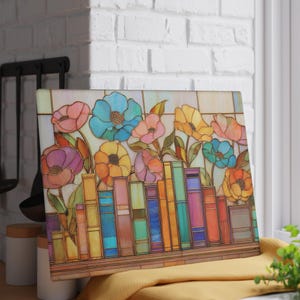 May include: Rectangular decorative panel featuring a colorful floral and bookshelf design. The artwork showcases vibrant flowers in shades of pink, blue, and yellow above a row of books. The panel is set against a window.
