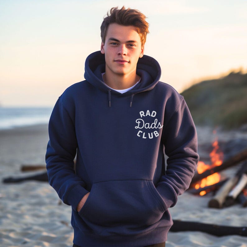 May include: A navy blue hooded sweatshirt with a white embroidered logo that says "Rad Dads Club".
