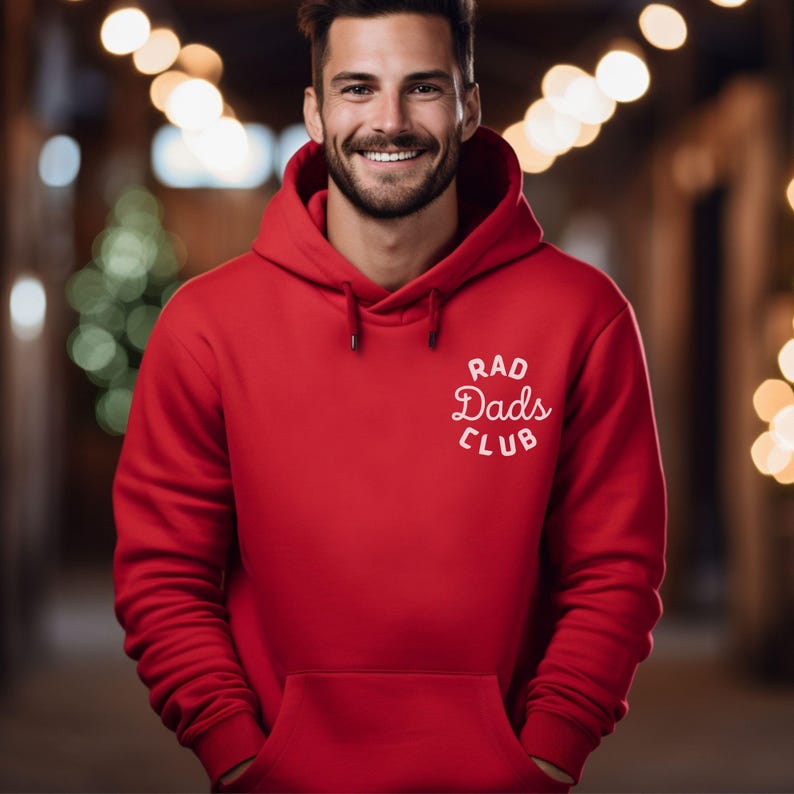 May include: A red hooded sweatshirt with the text "Rad Dads Club" in white lettering.