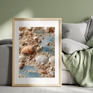 May include: A framed print of a seashell arrangement on a sandy beach with blue water flowing through the sand. The shells are various shapes and sizes, with some having a white, brown, and orange colour pattern.