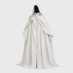 May include: A long, white hooded cloak with a button-up front. The cloak has a flowing design and is made of a soft fabric. The hood is large and covers the head. The cloak is designed to be worn over other clothing.