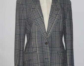 May include: A grey, black and purple plaid blazer with a single button fastening. The blazer has a notched collar and flap pockets.