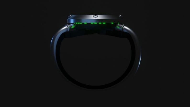 May include: A black wristwatch with a green digital display. The watch is designed with a circular face and a band that wraps around the wrist.