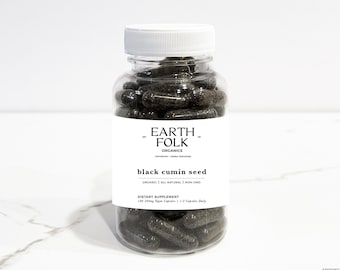 May include: A clear glass bottle filled with black capsules labeled "EARTH FOLK ORGANICS black cumin seed ORGANIC | ALL NATURAL | NON GMO DIETARY SUPPLEMENT 120 500mg Vegan Capsules / 2 Capsules Daily"