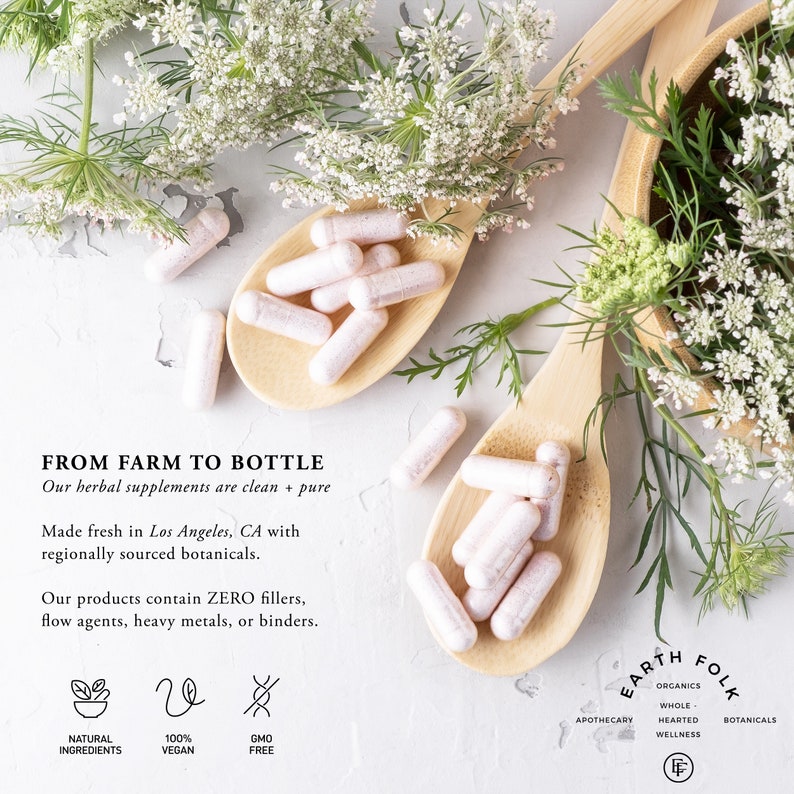 May include: Two wooden spoons filled with white capsules, surrounded by green plants and white flowers. The text "FROM FARM TO BOTTLE" is visible, along with the words "Our herbal supplements are clean + pure".  The text "EARTH FOLK" is also visible, along with the words "ORGANICS, WHOLE HEARTED WELLNESS, BOTANICALS".